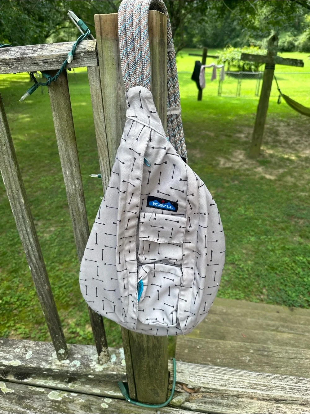 Kavu Sling Bag in Light Beige with Black Arrow Print